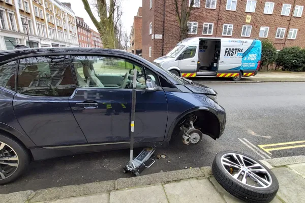 BMW i3 home tyre repair on the driveway