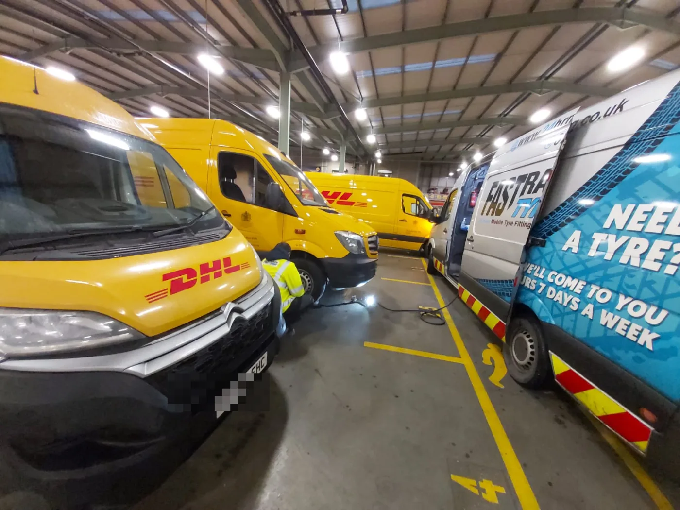 Fastrack servicing a DHL delivery-van fleet at their depot — contract mobile tyre fitting