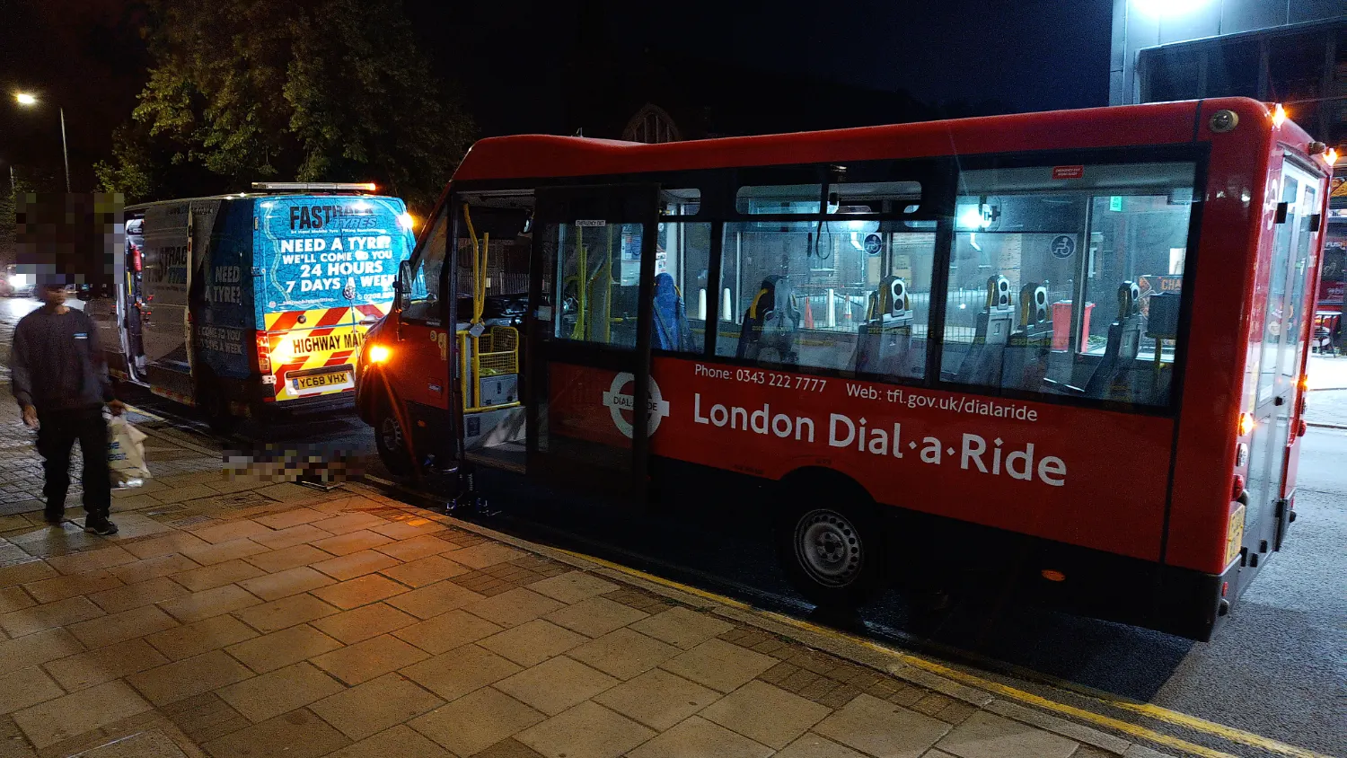 Fastrack changing a London Dial-a-Ride community bus tyre at night