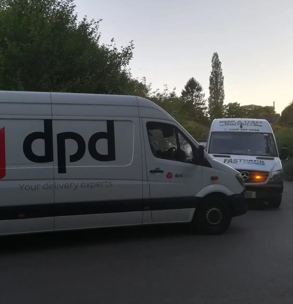 Fastrack van on a fleet tyre call-out alongside a DPD delivery van