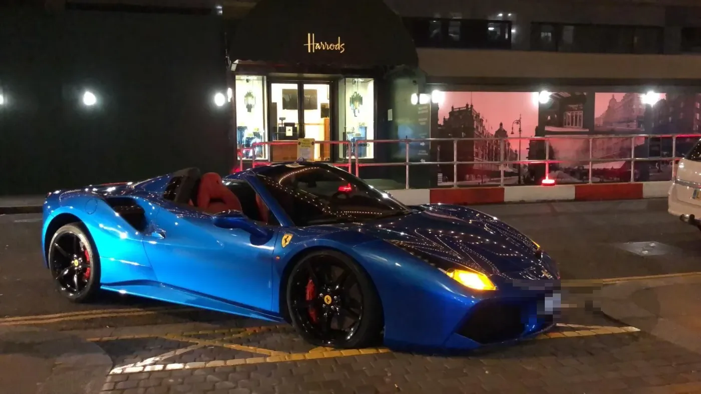 Blue Ferrari 488 Spider outside Harrods during a night tyre call-out