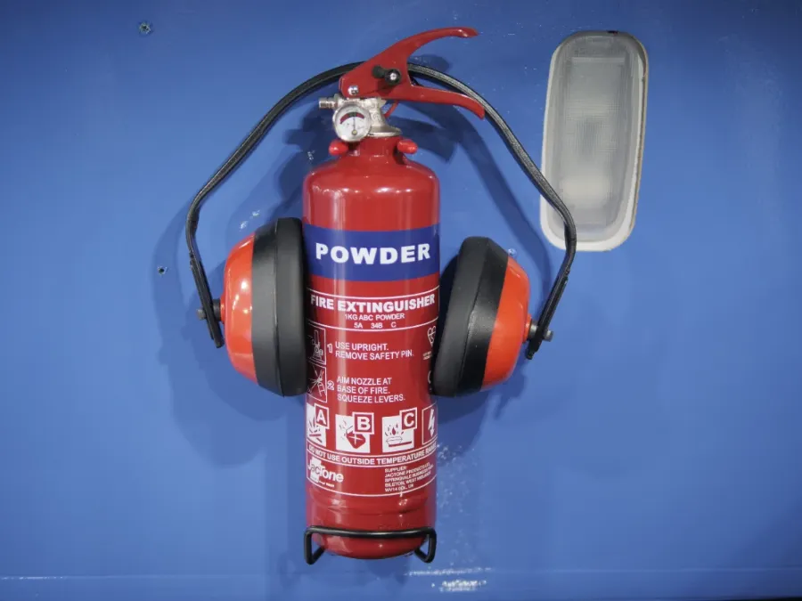 Fire extinguisher and ear defenders mounted inside the Fastrack van