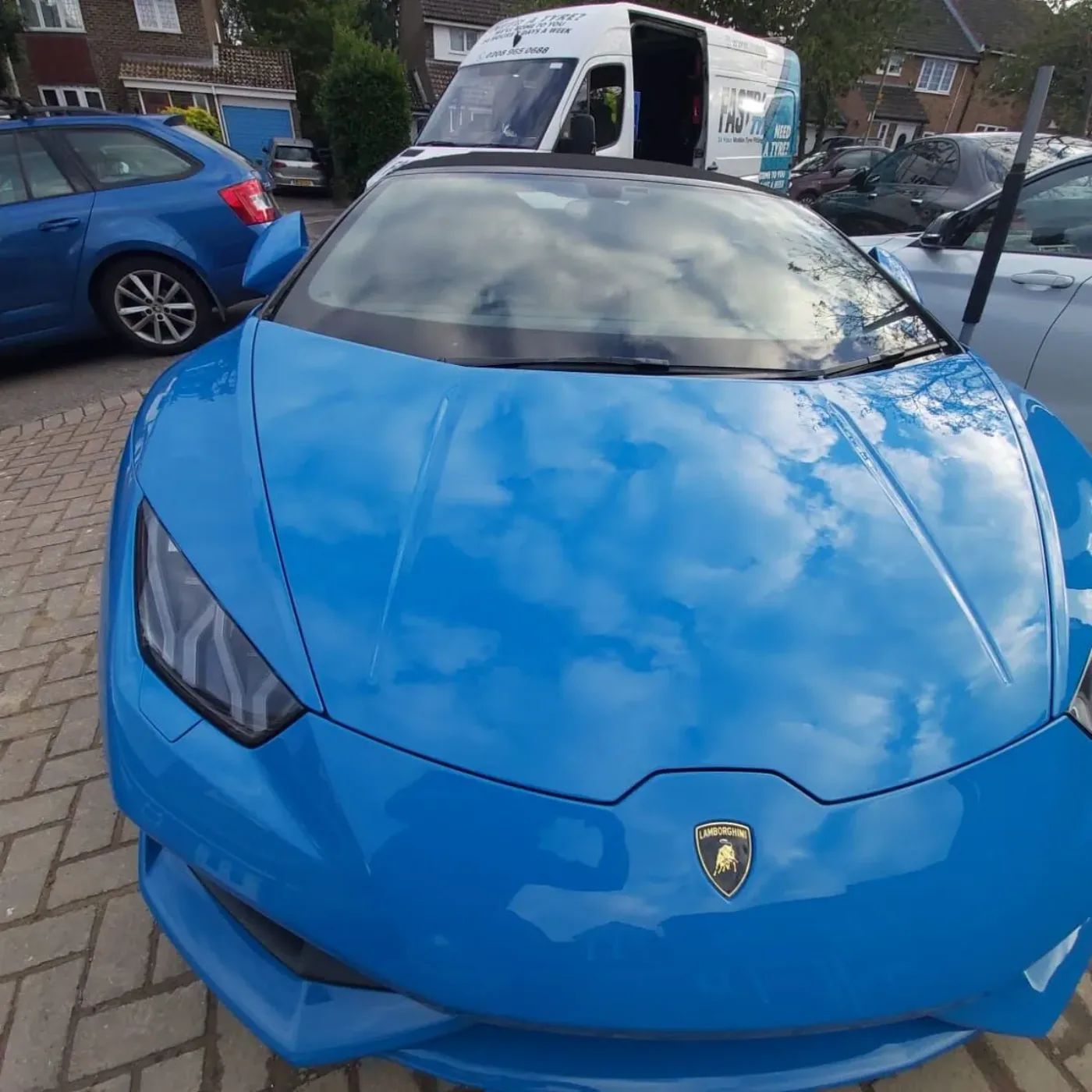 Bright blue Lamborghini Huracan during a mobile tyre fitting