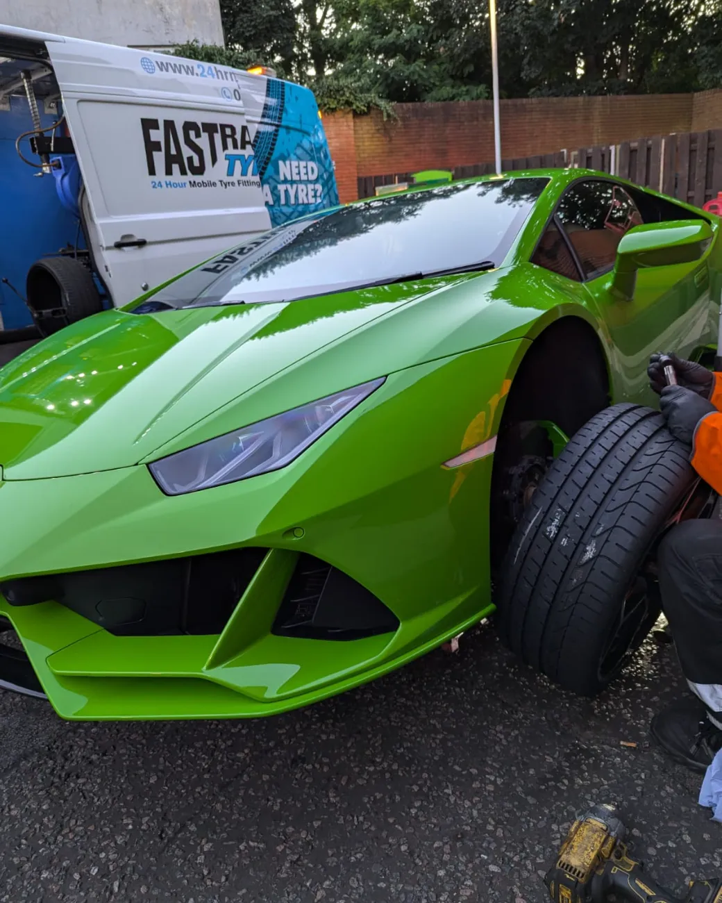 Green Lamborghini Huracan EVO during a mobile tyre fitting