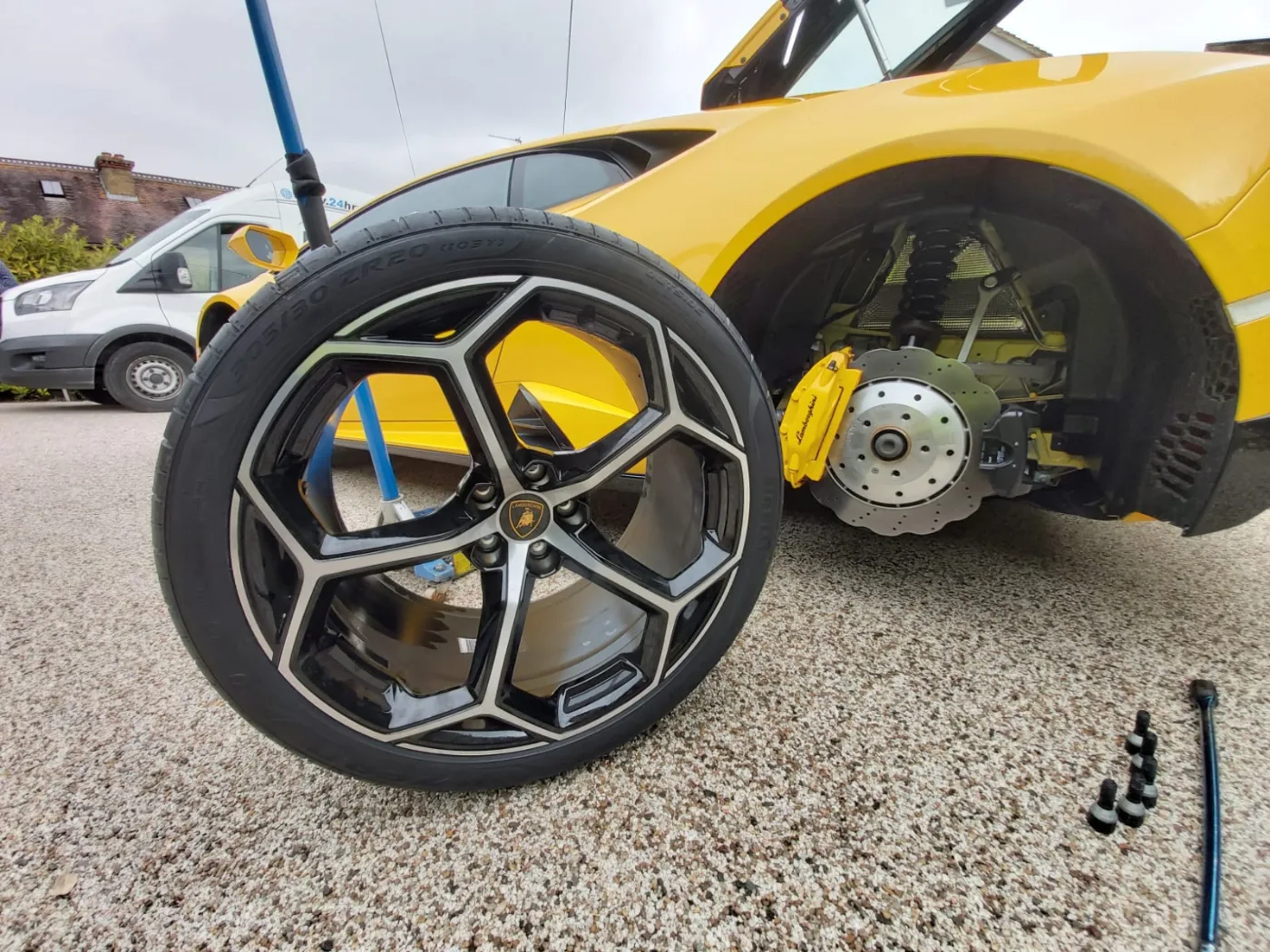 Lamborghini Huracan alloy with Pirelli P Zero and yellow caliper during a mobile tyre change