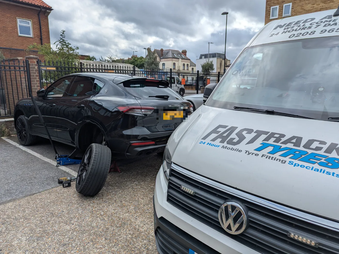 Maserati Levante with a rear wheel off during a mobile tyre replacement