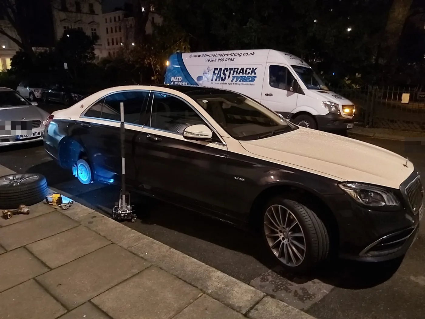 Two-tone Mercedes-Maybach S-Class on a night-time mobile tyre call-out in London
