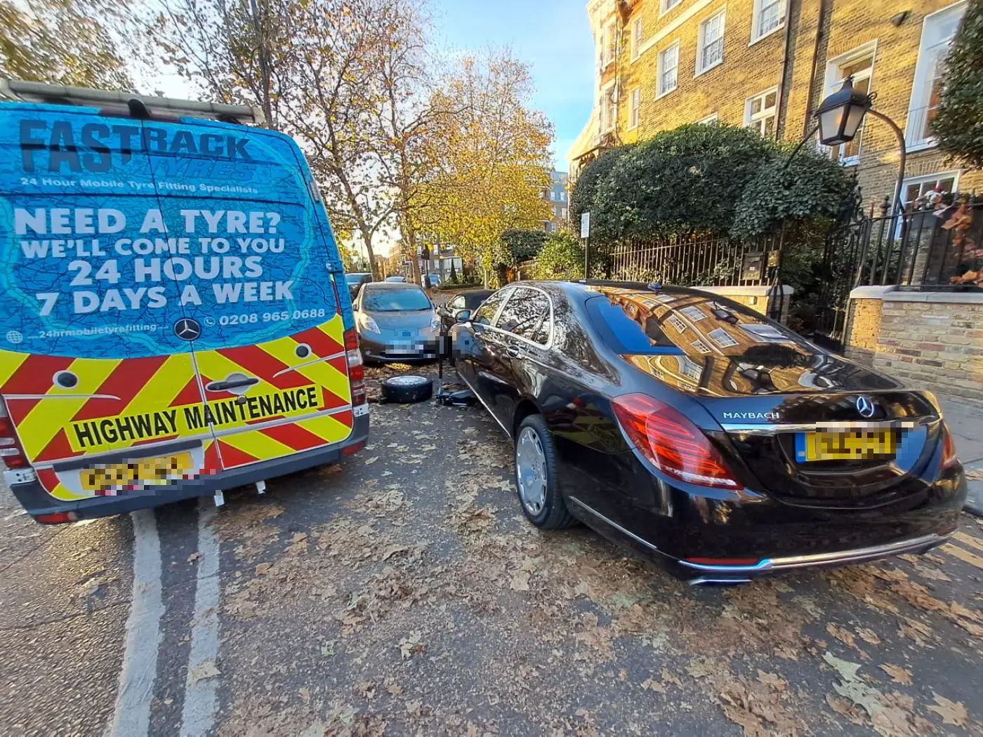 Mercedes-Maybach S-Class wheel change on a leafy London street