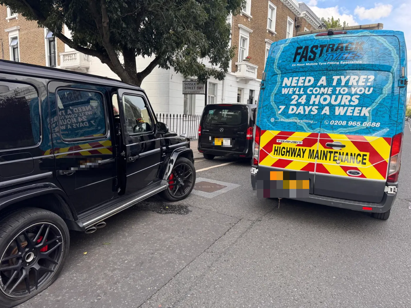 Mercedes-AMG G63 wheel change at the kerbside in Westminster