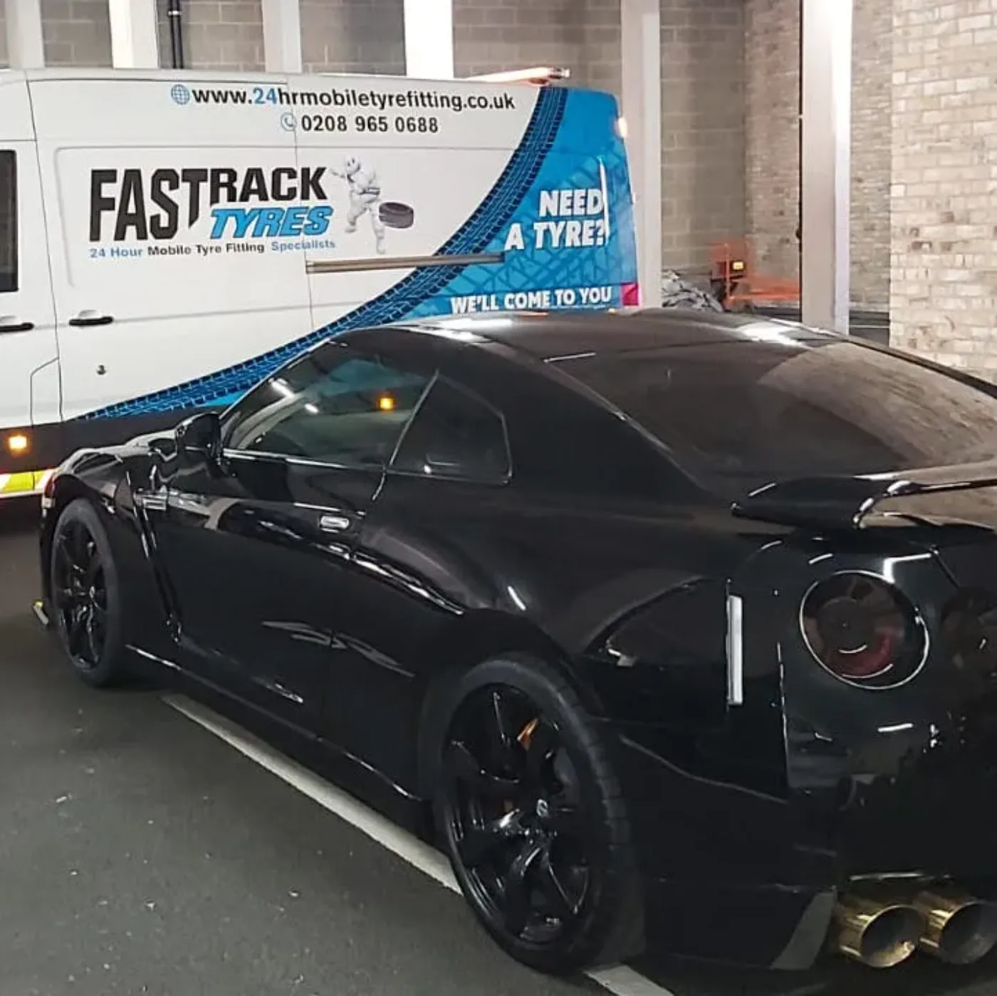 Black Nissan GT-R on a night-time mobile tyre call-out
