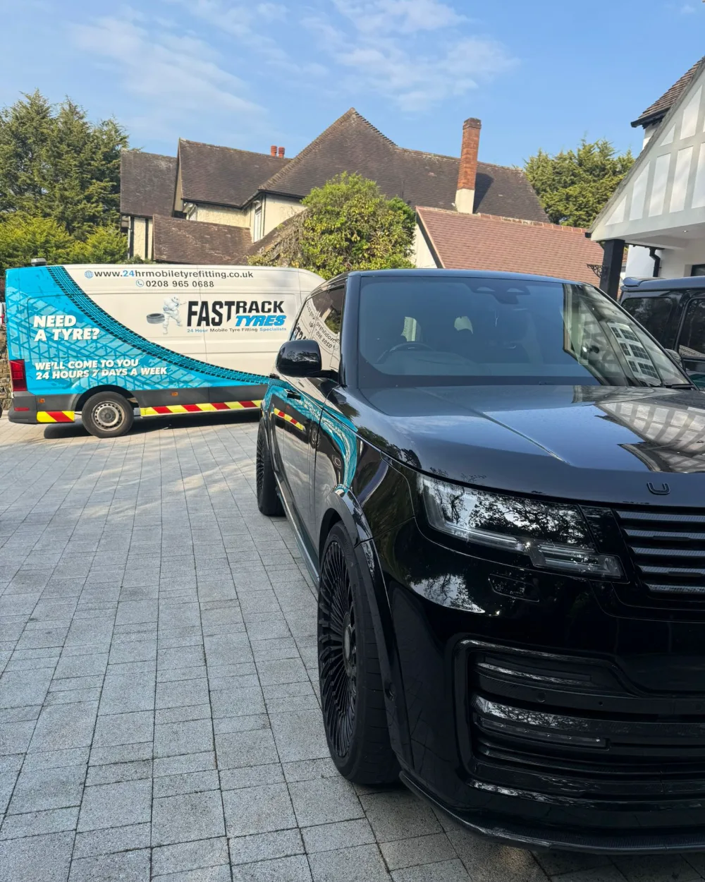 Saloon car mobile tyre change close up in London