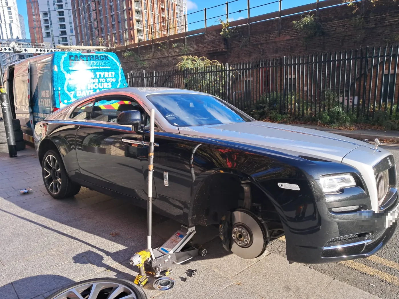Rolls-Royce Wraith with a wheel off for a mobile tyre replacement
