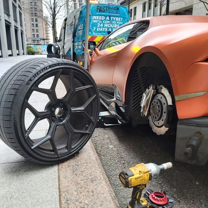 Sports car wheel-off roadside tyre change